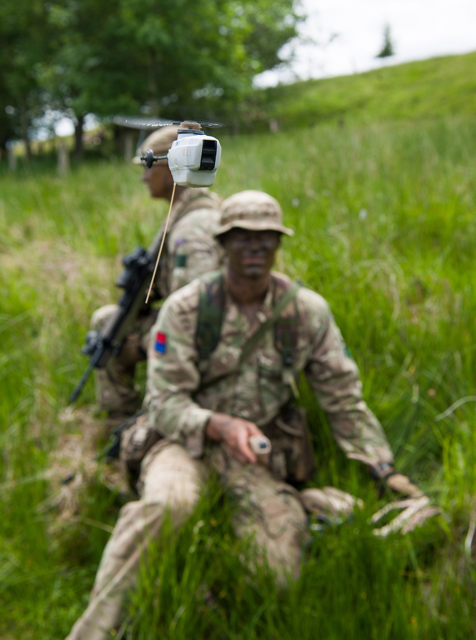 Royal Artillery soldiers use a Black Hornet nano UAV during a training exercise