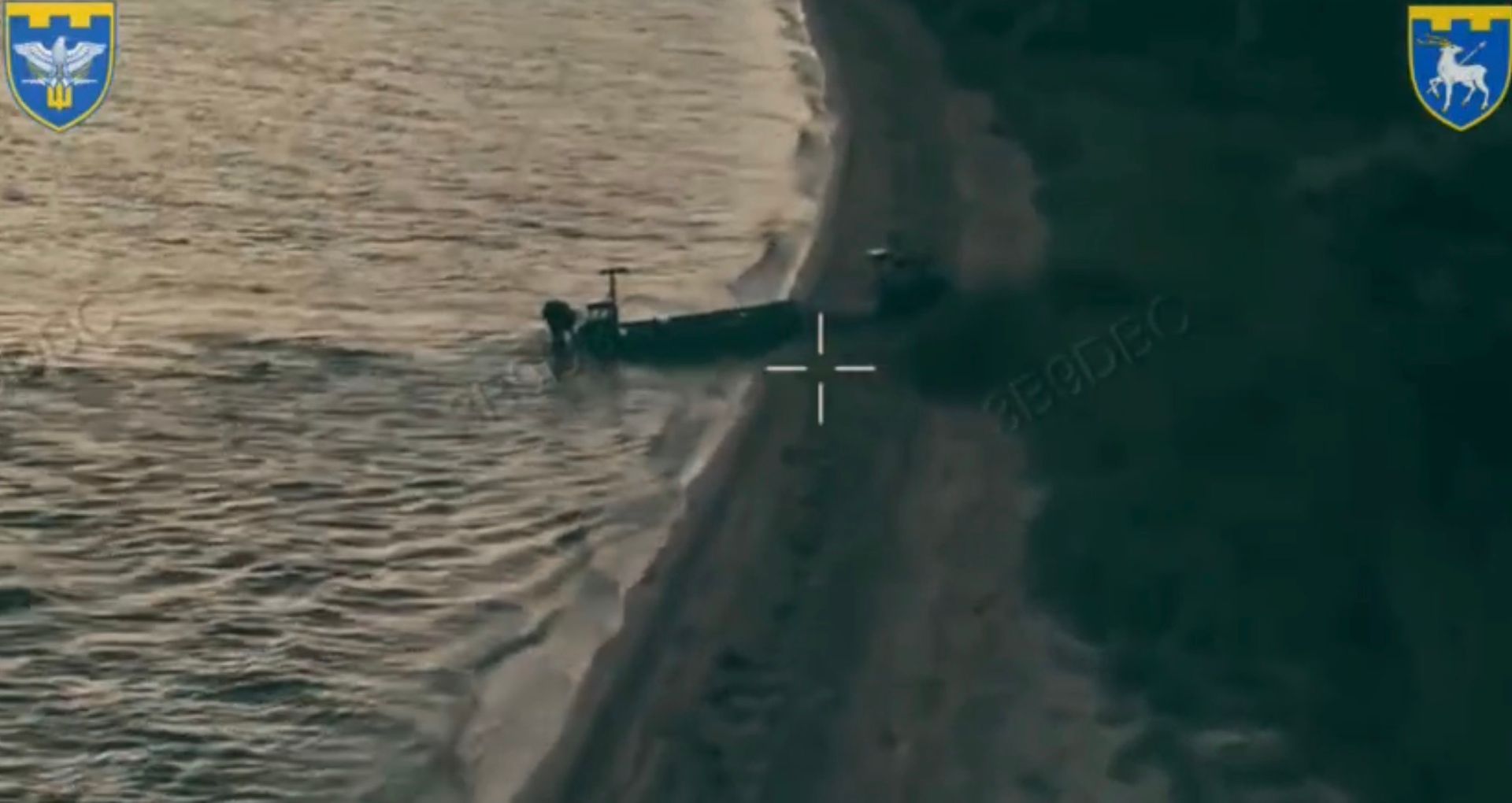 An uncrewed maritime platform at a shoreline in video released by Ukraine's 123rd Territorial Defense Brigade